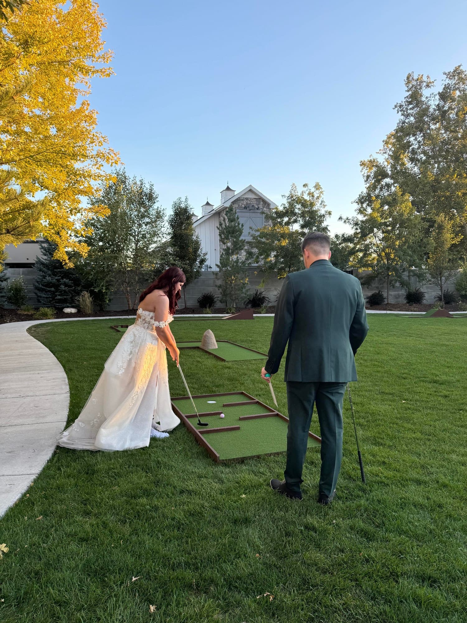 A couple playing Putts at a wedding